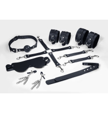 Набір Feral Feelings BDSM Kit 7 Black, наручники, поножі, конектор, маска, падл, кляп, затискачі